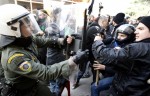 Protesters clash with policemen during a rally near the courthouse where defendants Epaminondas Korkoneas and Vassilis Saraliotis are standing trial in Amfissa town, northwest of Athens January 20, 2010. Korkoneas and Saraliotis face a court trial for the fatal shooting of teenager Alexandros Grigoropoulos in December 2008, which sparked the country's worst riots in decades. 
