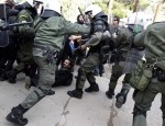 Protesters clash with policemen during a rally near near the courthouse where defendants Epaminondas Korkoneas and Vassilis Saraliotis are standing trial in Amfissa town, northwest of Athens January 20, 2010. Korkoneas and Saraliotis face a court trial for the fatal shooting of teenager Alexandros Grigoropoulos in December 2008, which sparked the country's worst riots in decades.